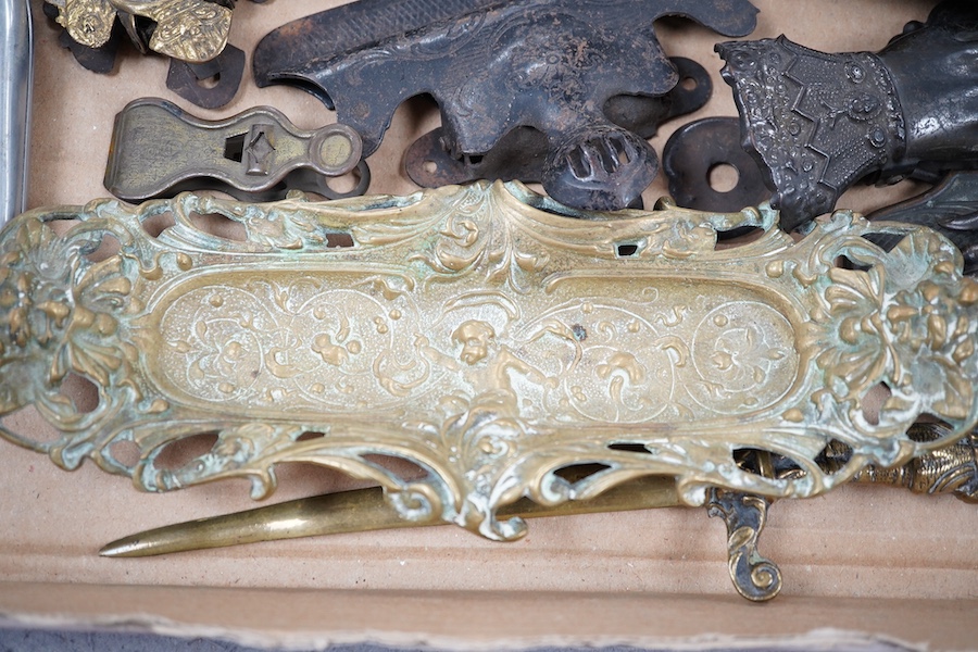 A collection of novelty hand and other desk paper clips, including a large mother of pearl shell, a pietra dura plaque and a brass pen stand, 22cm high. Condition - one poor but mostly fair to good